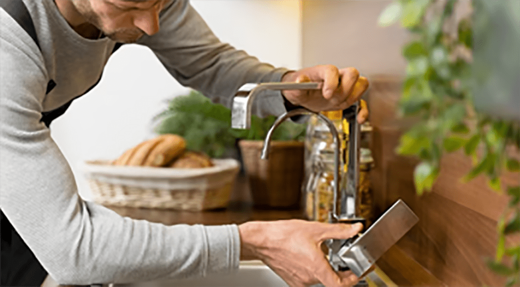 Technician providing water house connection service in Maryland Technician providing water house connection service in Maryland